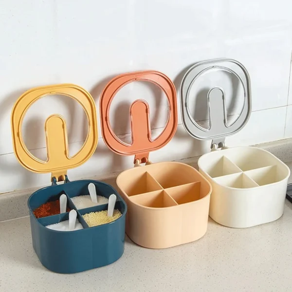 Three square spice containers with four compartments each. The containers are blue, orange, and white, with clear lids and small spoons. Top Quality Masala Spice Box